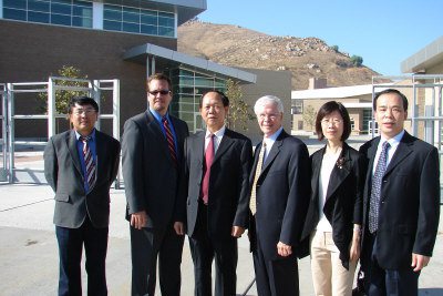 Dr. Li Chen and David Long at Hillcrest High School (source)